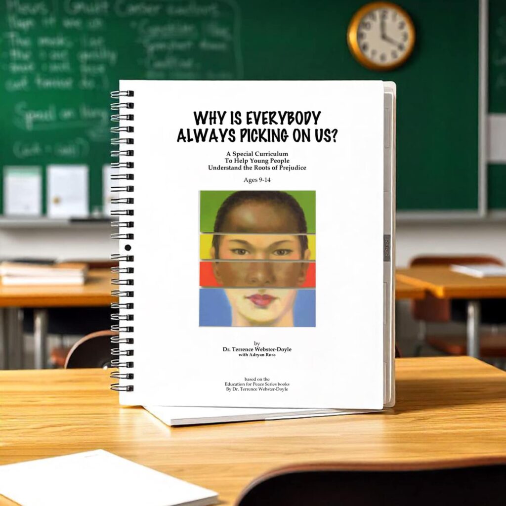 Spiral-bound educational curriculum book titled "Why is Everybody Always Picking on Us?" on a wooden classroom desk with a blurred chalkboard and clock in the background.